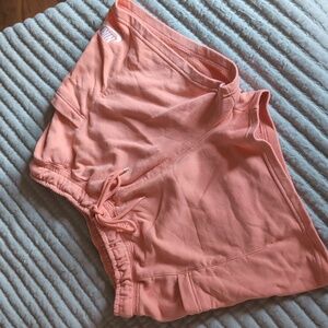 Nike Air women's jogger style shorts pockets orange drawstring medium